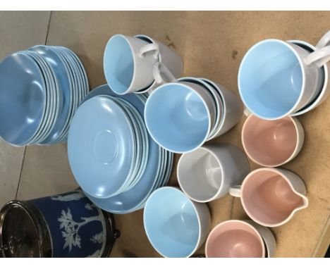 A poole pottery mid 20th century design part dinner and coffee set decorated with blue and pink.