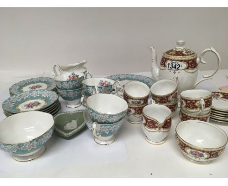 A Royal Albert Bone China Enchantment pattern six place tea set no obvious damage or restoration with a cream jug side plates