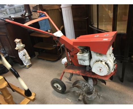 A 5hp Woolseley Rotary Cultivator. With instruction manual.