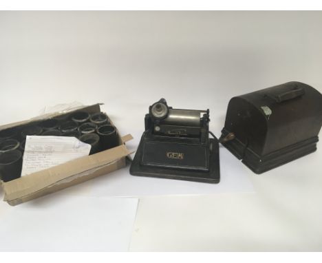 An Antique Edison Gem Phonograph circa 1899 with oak cover and a quantity of music cylinders.