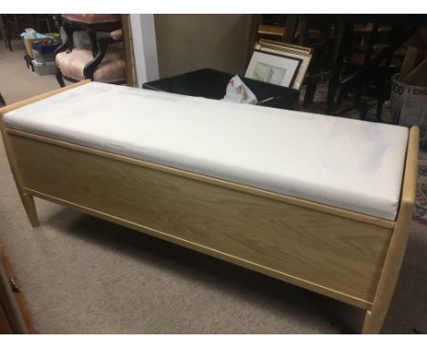 A Ercol ottoman with Hinged  rectangular  Seat .