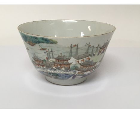 A Chinese Export Porcelain famille Vert bowl decorated with a harbour view buildings hand painted caricature marks and furthe