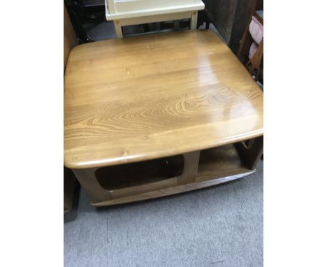 A low Ercol table with single drawer.