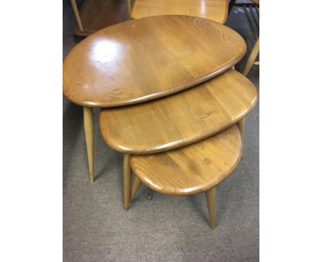An Ercol nest of pebble tables .
