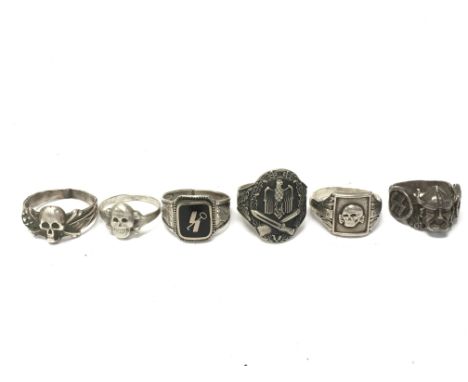 A collection of Retrospective WW2 German Third Reich Rings including a 12th Panzer Division ring, a General Assault badge rin