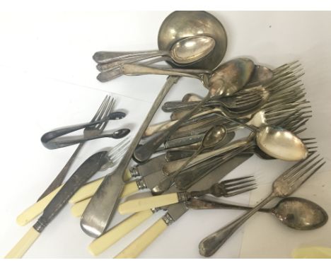 A collection of silver plated cutlery including a large ladle.