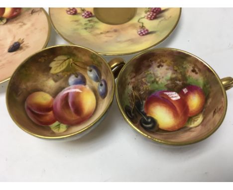 Two small Royal Worcester cups and saucers decorated with fruit.5.5 cm no damage or restoration.