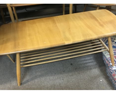 A Ercol rectangle coffee table on turned legs .