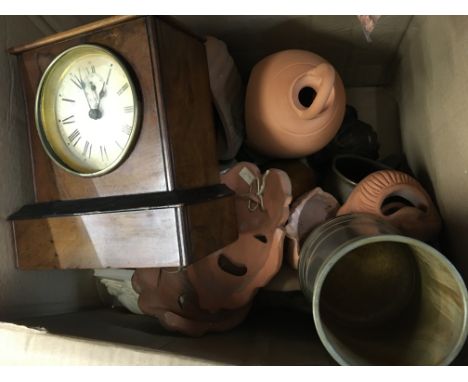 A box containing a small Walnut mantel clock small items of treen terracotta wall masks and ornaments (a lot)- NO RESERVE