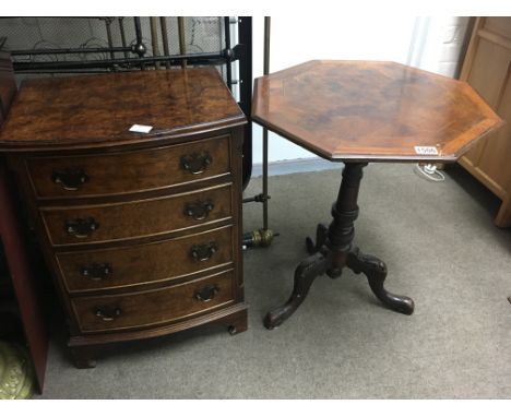 A small walnut bow fronted set of drawers fitted with four drawers and bracket feet And a Victorian walnut occasional table