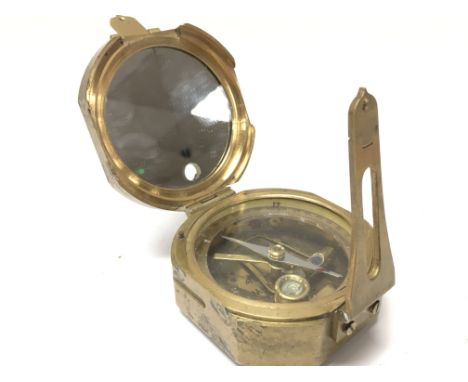 A brass cased compass, postage category B