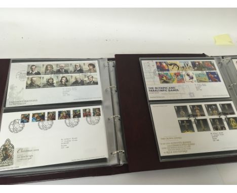 Two albums containing Ryal Mail first day covers all in sleeves good presentation (2)
