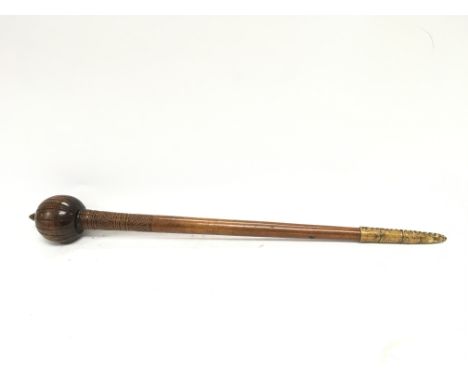 An unusual knobkerrie possible from circa 19th century. Carved shaft with skin applied at the base. Possible maruia. 71cm lon