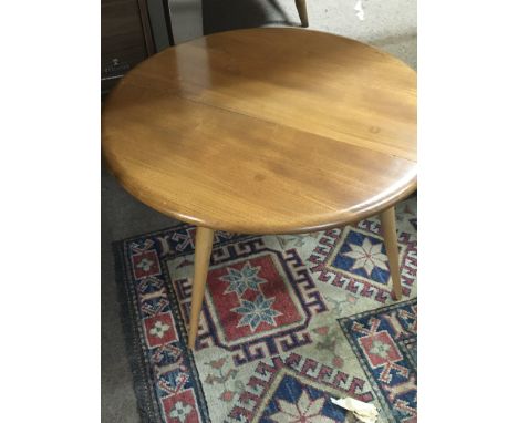 A light Ercol  small occasional table .