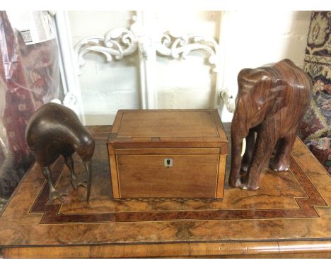 A regency mahogany tea caddy, a rosewood elephant and a kiwi (3). Shipping category B.