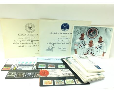 A Collection of first day covers and stamps including a signed photograph of the Apollo 15 crew dated 1971 and certificates
