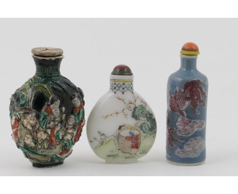 Chinese famille verte moulded porcelain snuff bottle, Kangxi marks, moulded with figures in green enamel against a black grou