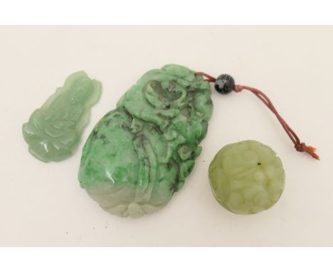 Chinese jadeite pendant, carved as a gourd fruit in spinach jade, 6.5cm x 4cm; also a carved jadeite ball toggle and a carved