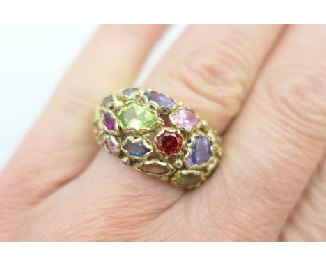 9ct gold multi gem set dress ring, set with various coloured gemstones, pave set on a broad 9ct gold band, size O, gross weig