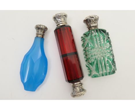 Victorian ruby glass double ended scent bottle, with silver repousse caps, worked with leaves, unmarked, 12cm; also a Victori