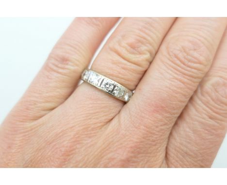 Diamond half eternity ring, set with seven brilliant cut diamonds totalling approx. 1.76cts, in unmarked white metal rub over