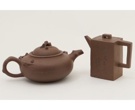 Chinese Yixing teapot and cover, of rectangular section inscribed with script, height 10cm; also a further Yixing teapot, mou