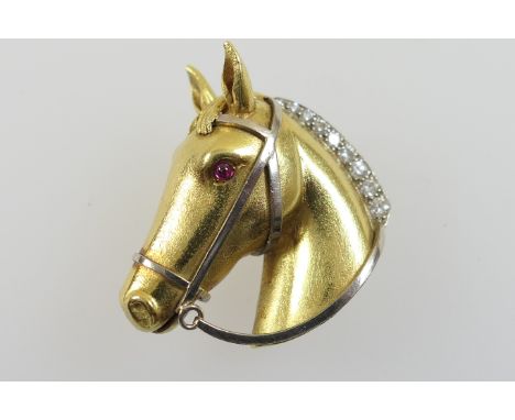 Boodles 18ct gold and diamond equestrian brooch, finely worked as a horse's head, with ruby eyes and a graduated brilliant cu