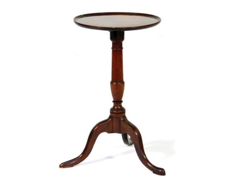 Mahogany adjustable pedestal tripod table, 19th Century, the dished circular top rising and falling over a turned urn column 