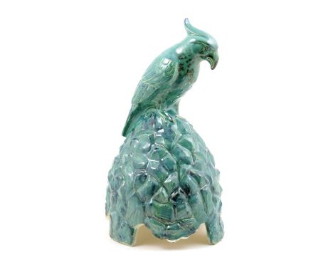 Doulton & Co. speaker cover for Artandia, circa 1927, modelled as a parrot perched on a rock and decorated all over in a turq