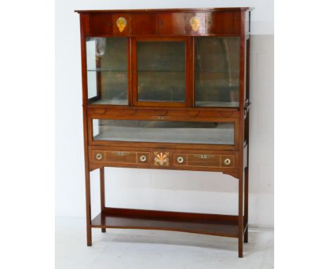 Secessionist style mahogany and inlaid display cabinet, circa 1900, the bow fronted top with four small cupboard doors and in