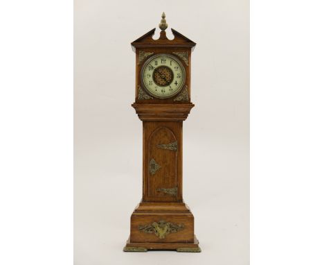 Late Victorian oak miniature longcase clock, the dial with Arabic numerals, later battery operated movement, the case embelli