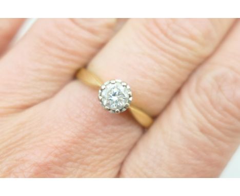 Diamond solitaire ring, the brilliant cut pique stone of approx. 0.5ct, within a white metal illusion claw mount on an 18ct y