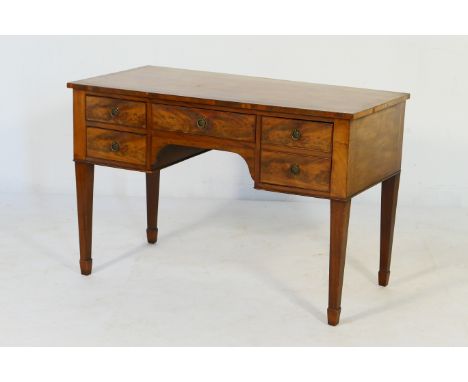 Edwardian mahogany dressing table, circa 1900-10, the top crossbanded and with a configuration of five drawers around a centr