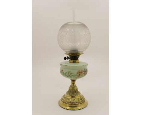 Victorian pedestal oil lamp, with etched glass spherical shade over a hand decorated green opaline glass tank and brass conic