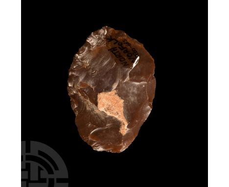 Neolithic Period, circa 6th-4th millennium B.P. Heavily knapped form, dark drown in colour with inked inscription: 'NORTH / N