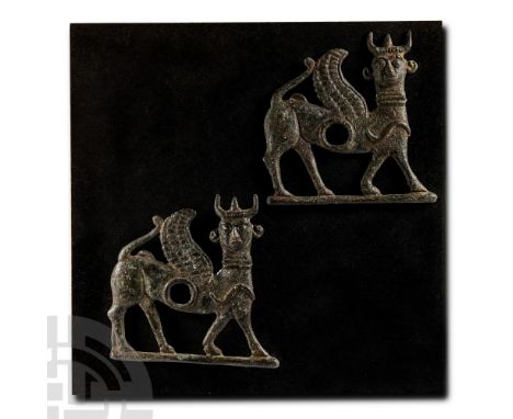 9th-8th century B.C. Comprising two terminals in the form of human-headed horned and winged sphinxes; mounted on a custom-mad