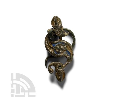1st-2nd century A.D. Delicately moulded brooch with low-relief detailing, cells to accept enamel fill; S-curved pin in situ, 