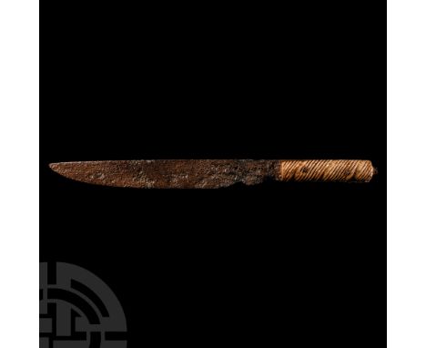 1st-4th century A.D. With single-edged blade gently curving towards the tip; applied bone handle with diagonally striated ban