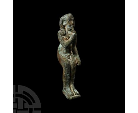 Late Period, 664-332 B.C. With feet resting on a rectangular base, forefinger on the lips, prominent sidelock of youth. Cf. s
