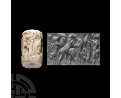 Circa 3rd millennium B.C. With carved frieze showing fighting scenes with a hero and animals; shell or polished stone. Cf. Co