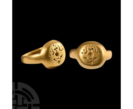Circa 16th century A.D. Discoid domed bezel with central socket, scroll and foliage motifs. Cf. Chadour, A.B., Rings. The Ali
