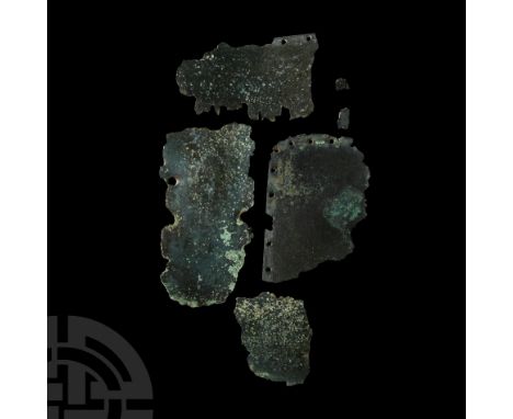 3rd-4th century A.D. Comprising four large plate sections from a segmented armour for arm (manica) or leg, three with pierced