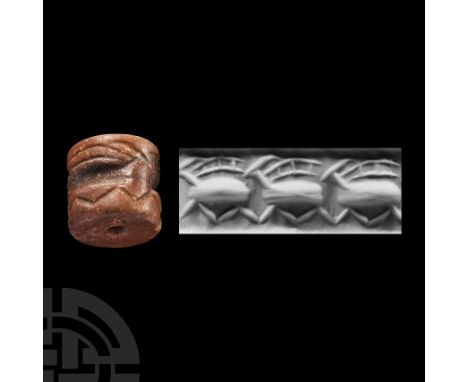 Circa 3rd millennium B.C. With running frieze of animals in an undulating band. Cf. Teissier, B., Ancient Near Eastern Cylind