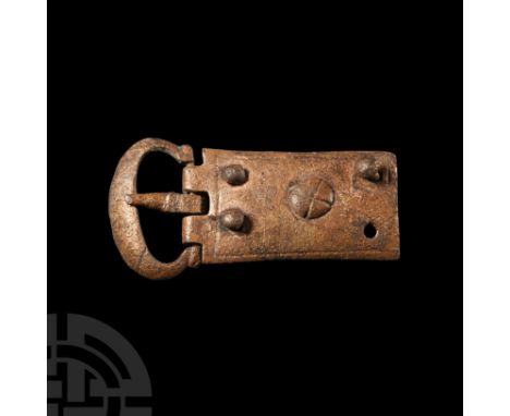 Circa 14th-15th century A.D. With gently tapering plate, broad loop and short tongue with rectangular guard; four attachment 