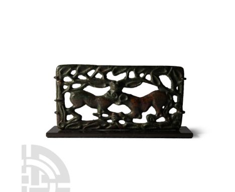 4th-3rd century B.C. Rectangular openwork panel with lioness biting the neck of a doe in a foliage setting; hook to one short