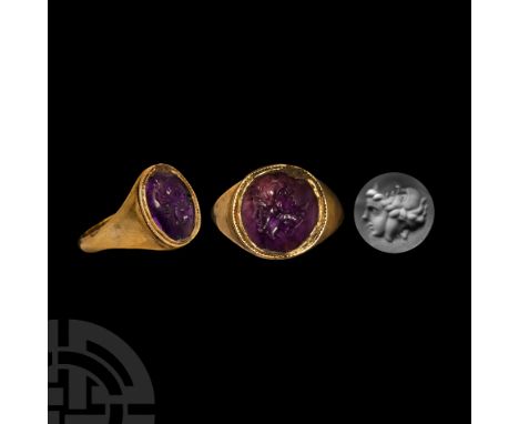 Circa 2nd-3rd century A.D. Hollow-formed gold ring in Hellenistic style with beaded rim to the broad bezel, inset amethyst ca