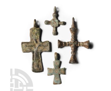 Circa 12th-14th century A.D. Comprising: one with a low-relief Corpus Christi; one with five incised ring-and-dot markings; o