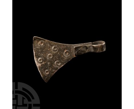 Circa 9th-11th century A.D. With ring-and-dot detail to one face, rivetted loop to the apex.  2.71 grams, 32 mm (1 1/4 in.).A
