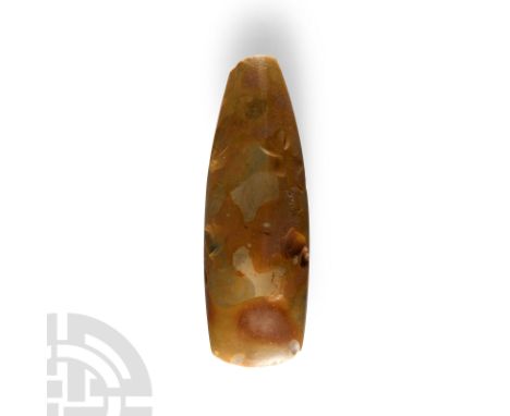 Neolithic Period, circa 6th-4th millennium B.C. Beautifully shaped and polished axe with gently curved cutting edge, tapering