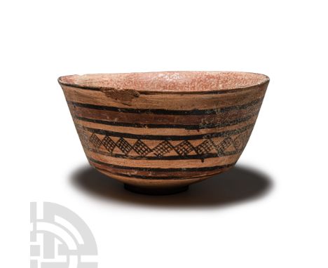 3rd millennium B.C. Squat bowl with baal ring, bands of painted geometric ornament to the outer face.  152 grams, 11.8 cm wid